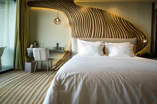 Luxurious bamboo sheets on a beautifully made bed in a serene bedroom with natural lighting and modern décor