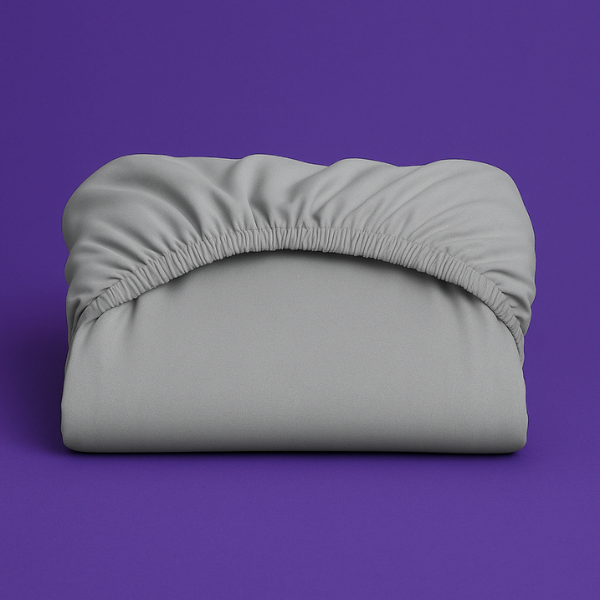 Premium gray fitted sheet with elastic edge displayed on a vibrant purple background. The sheet features a smooth, wrinkle-resistant fabric with deep pockets and secure elastic banding that ensures a perfect fit on mattresses.