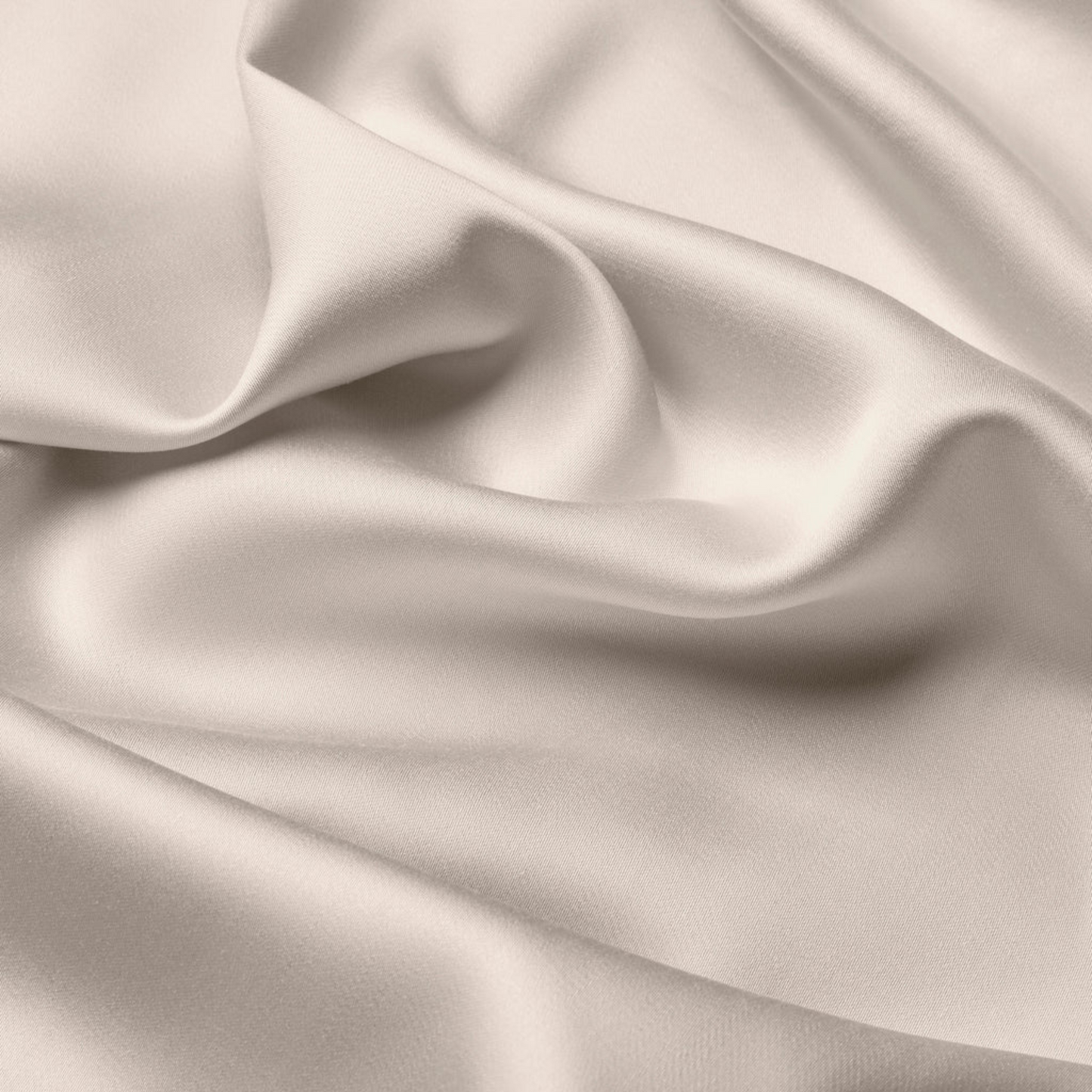 Silky satin fabric with folds in a neutral beige color