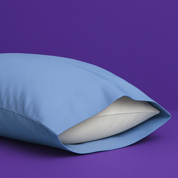 Elegant light blue pillowcase with a white pillow partially visible inside, set against a rich purple background. The premium pillowcase features a clean envelope closure design that securely holds the pillow while maintaining a sleek appearance.