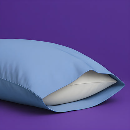 Elegant light blue pillowcase with a white pillow partially visible inside, set against a rich purple background. The premium pillowcase features a clean envelope closure design that securely holds the pillow while maintaining a sleek appearance.
