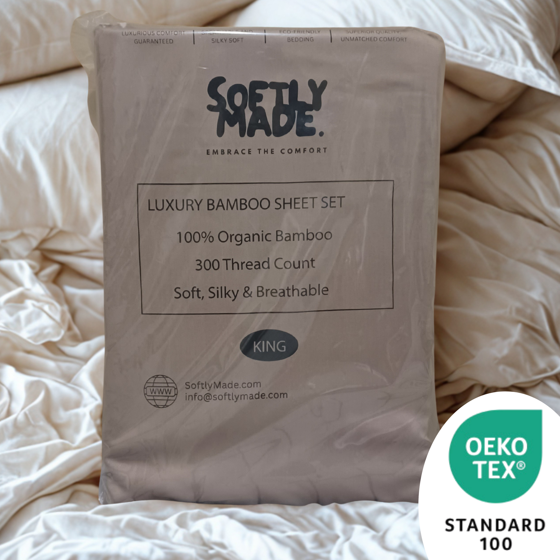 Softly Made luxury bamboo sheet set packaging on a bed with OEKO-TEX Standard 100 logo.