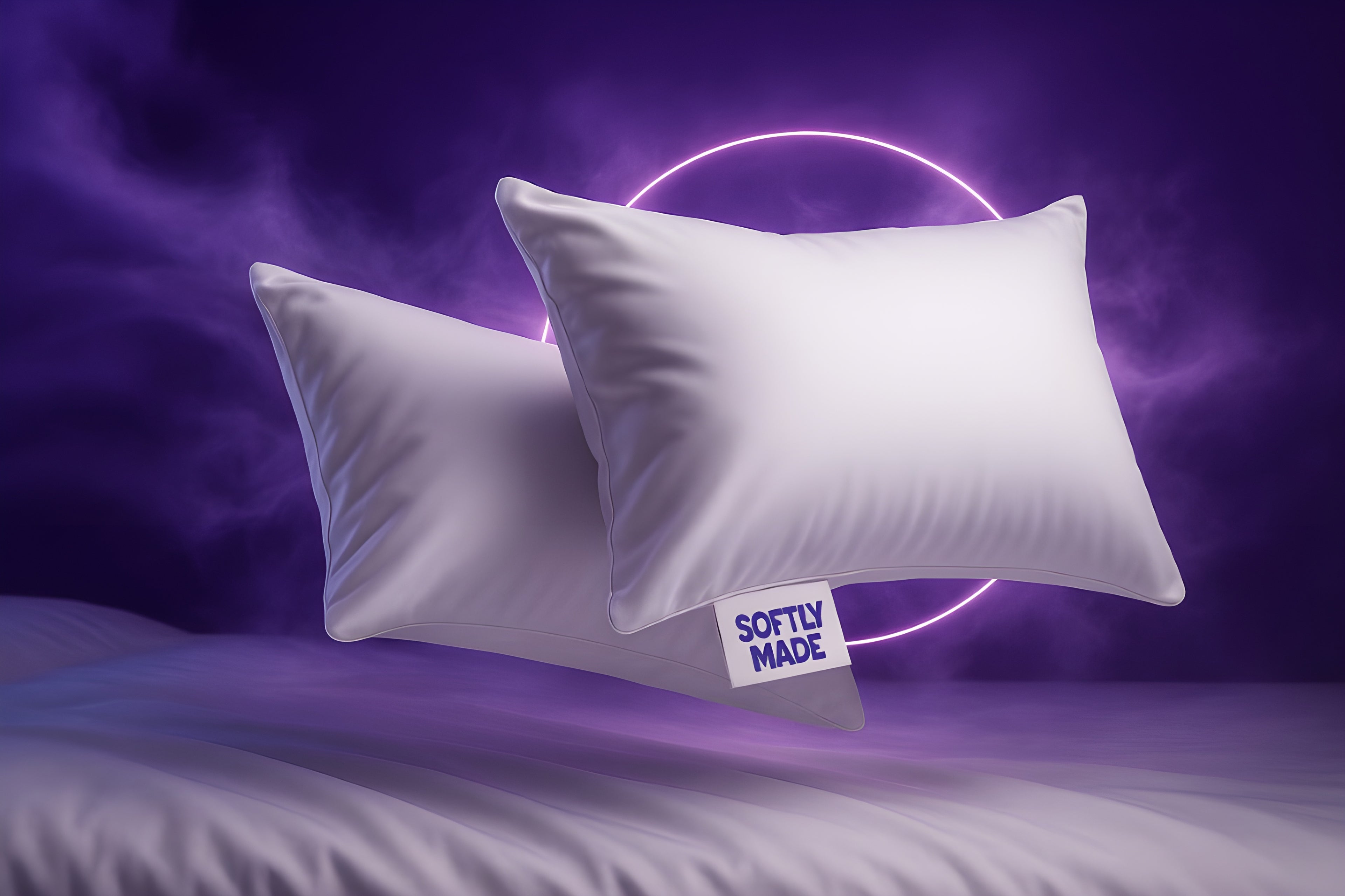 Two white SoftlyMade pillows floating against a dreamy purple background with glowing neon circle, showcasing the brand's premium pillowcases with a visible SoftlyMade tag, creating an ethereal, sleep-inducing atmosphere.