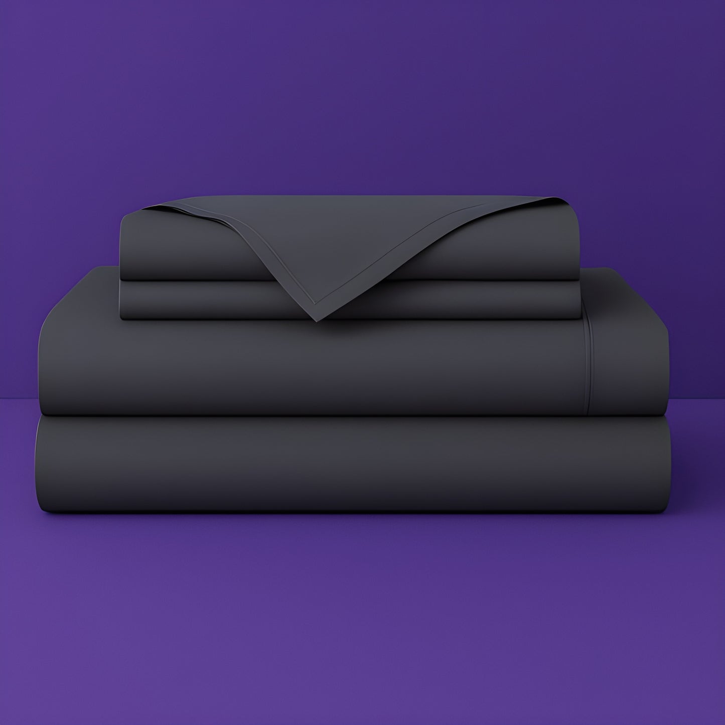 This image shows a neatly folded stack of dark grey bed sheets on a vibrant purple background. The stack includes what appears to be a fitted sheet, flat sheet, and pillowcases. The sheets have a smooth, crisp appearance suggesting high-quality bedding. The top sheet has a folded corner revealing the edge detail.